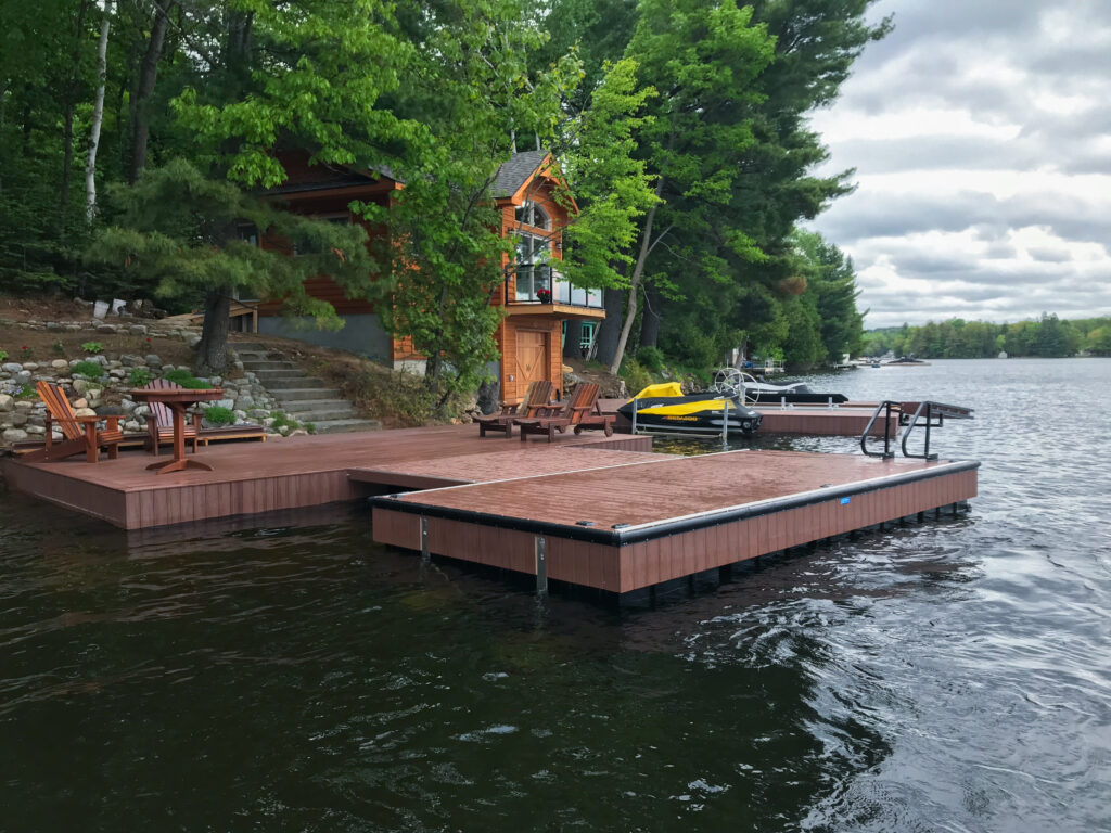 Dock with ladder on a lake with a forest background
