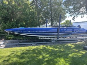 Large boat docked on a metal railway on property