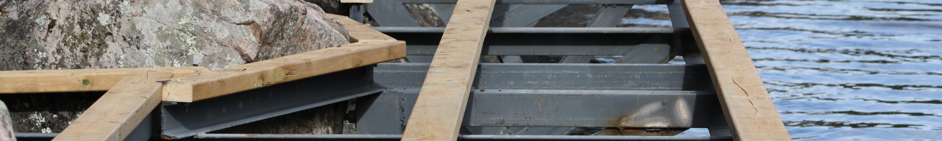 Close up of dock construction on rocky shore