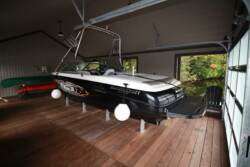 Hidden Beam Wet Slip Lift with decked platform- Boathouse fabrication by Greenway Construction