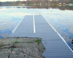 Lift up dock with shoreline profiled decking