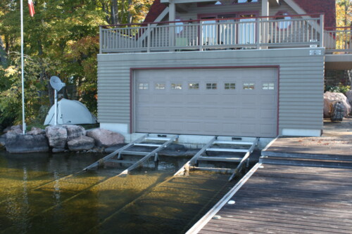 Marine railways into dry slip boathouse