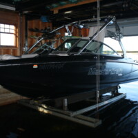Wet slip boat lift with mastercraft boat