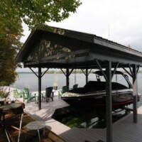 Wet Slip Overhead Lift in Boat Port Boat docked and lifted on a wet slip and covered by roof