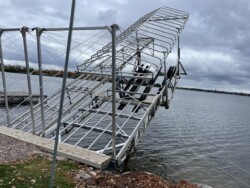 Metal dock lifted over water