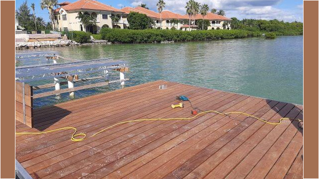 Wooden dock partially assembled on a lake