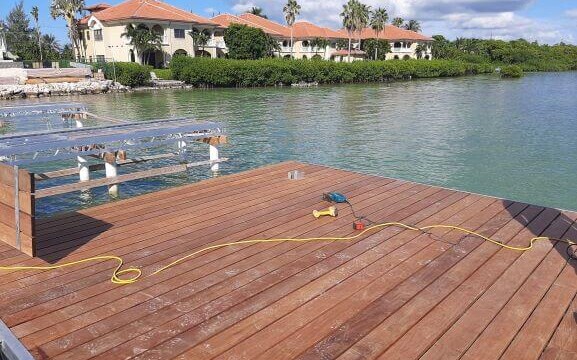 Wooden dock partially assembled on a lake