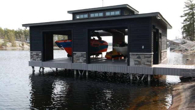 Black composite boathouse with doors open