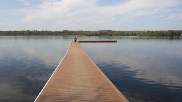 Long composite decking dock in lake