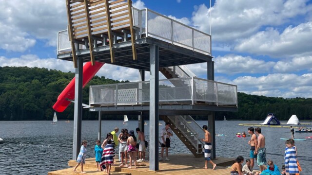 Tall platforms with stairs with waterslide on the water